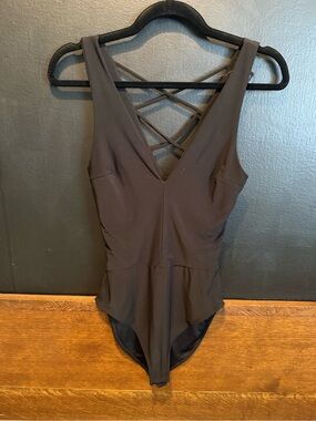 AQUA Black Cross-Back Peplum Bodysuit – Size XS